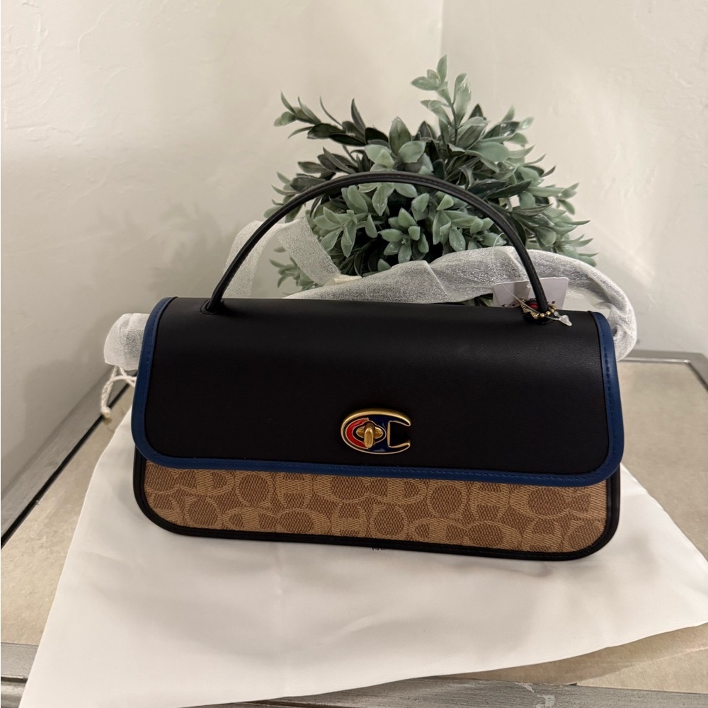 Coach X Champion Turnlock Clutch In Signature Canvas